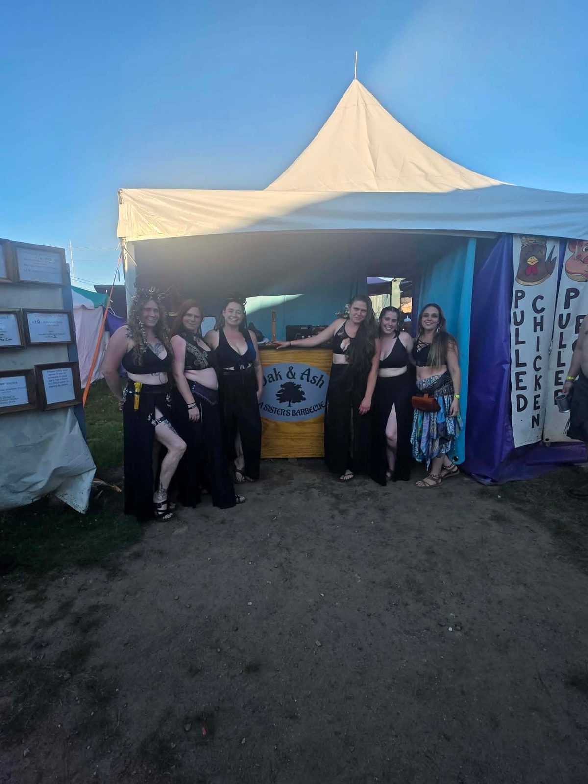 The Oak & Ash crew in faire dress in front of the booth