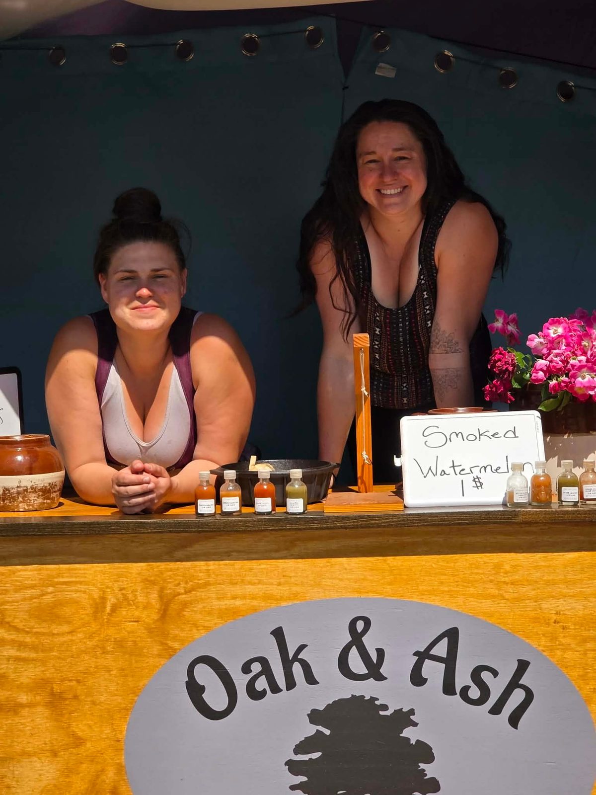 The two sisters behind the counter of the Oak & Ash booth at a Connecticut renaissance faire